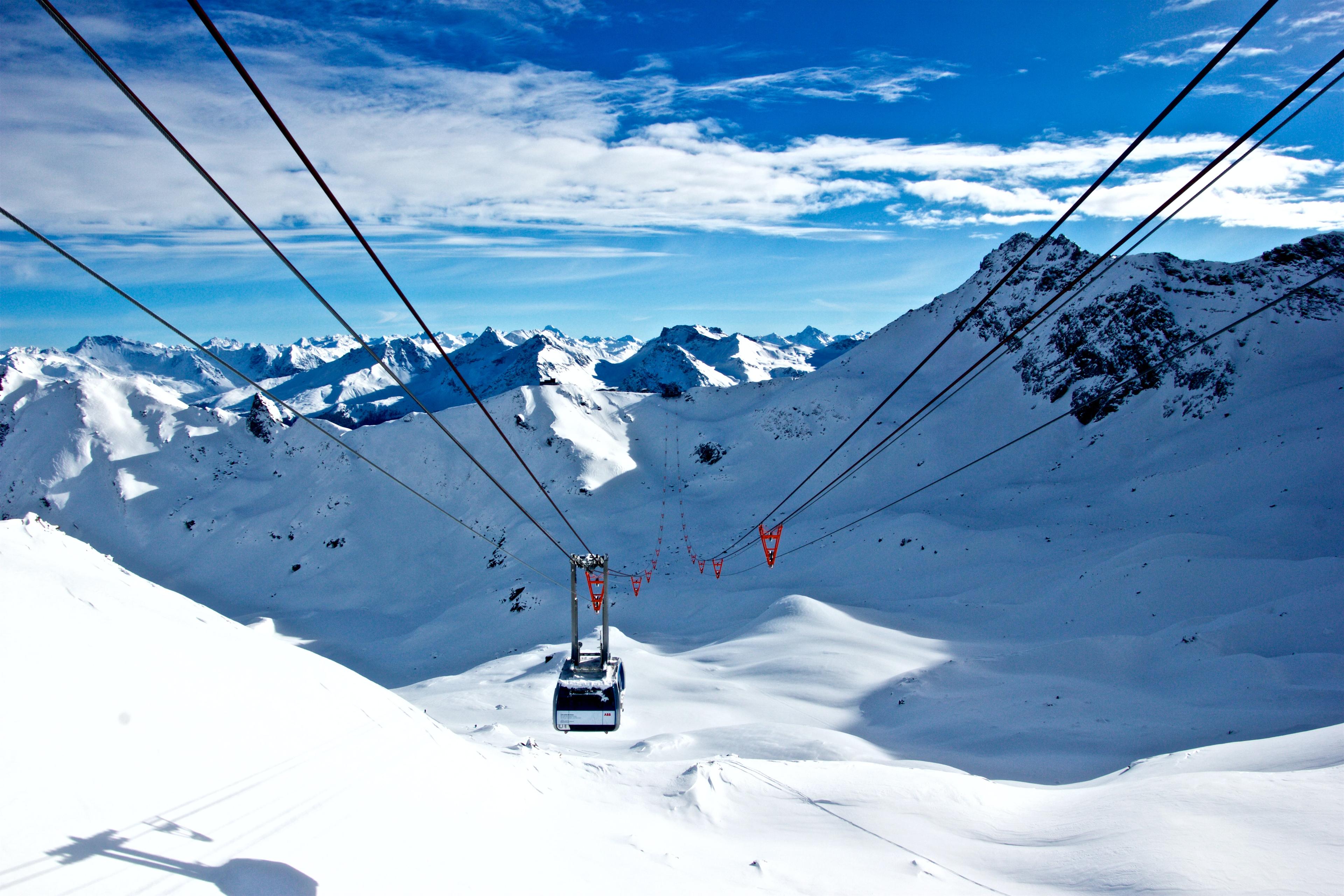 Gondolas transporting skiiers up ski mountain in Lenzerheide Switzerland